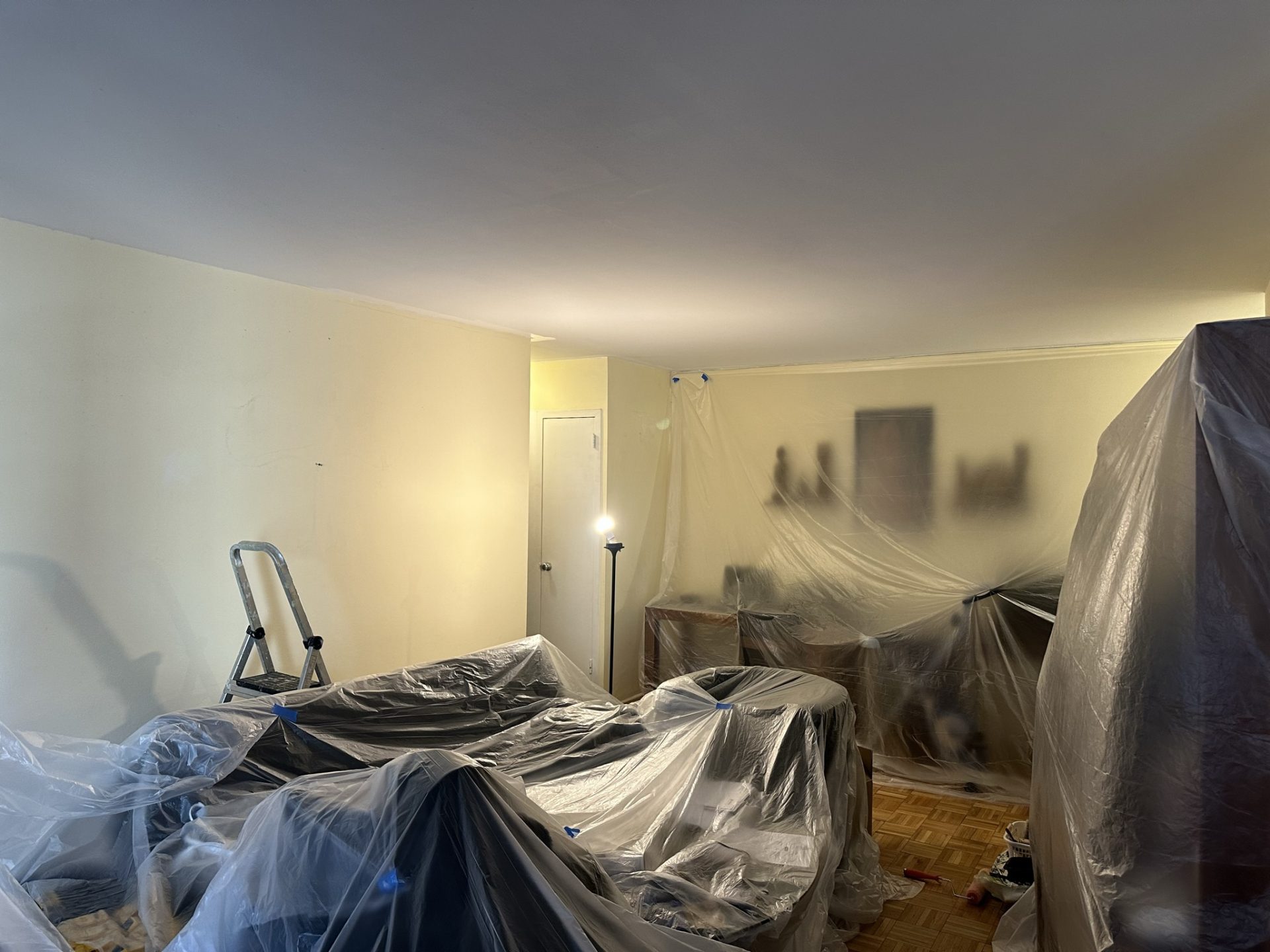 Room covered in plastic sheets